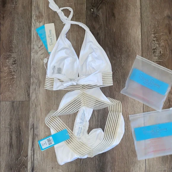 NWT Beach Bunny White and Gold Bikini 2 piece set
Halter top (L)
Bottoms (XL) - Picture 6 of 9